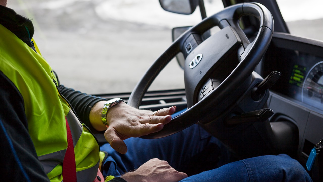 Driver steering a Volvo FH